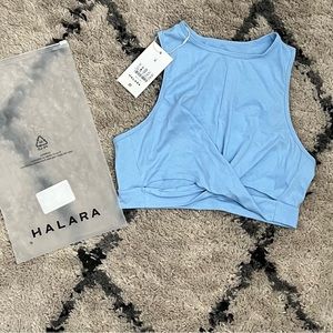 Light blue Workout top. Crop top with cutouts. NEVER WORN.